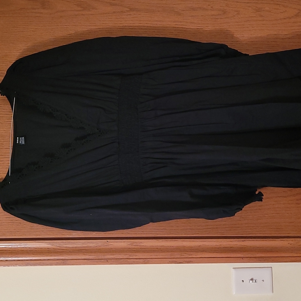 Seeing large knee length black dress. Size medium.